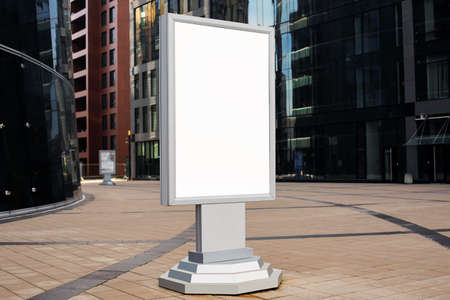 Advertising billboard with empty mockup screen background for promotional text message standing near...