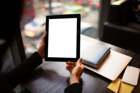 Close up woman skilled financier holding portable touch pad computer with empty mock up copy space...