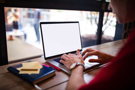 Man professional content writer keyboarding on laptop computer with empty mock up copy space screen...