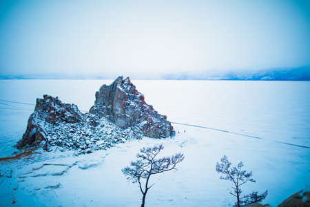 Shamanka Rock on Baikal lake in winter day. Beautiful nature landscape of Olkhon islandの写真素材