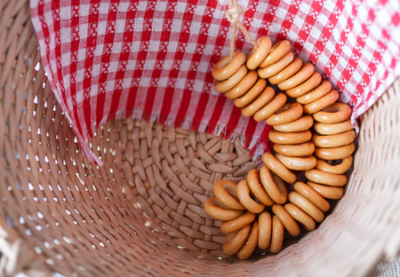 Russian traditional bakery food sushki and baranki background design still-life in the straw basketの写真素材