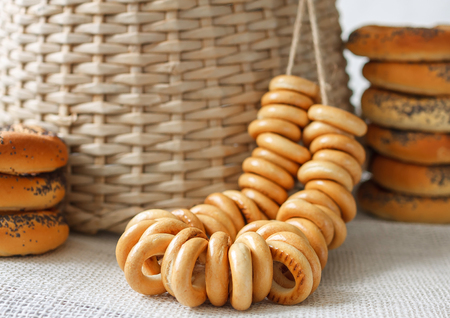 Russian traditional bakery food sushki and baranki background design still-life with straw basketの写真素材