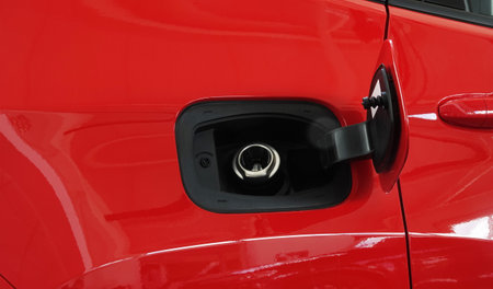 Open fuel tank door on car for fueling gasoline or diesel open. Transportation industry concept