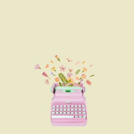 Typewriter keys keytops old style making lovely words of flowers. Creative literature poetry or nice words concept. Trendy pastel colorsの写真素材