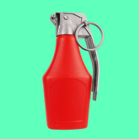 Ketchup bottle fast food classic red hot chili sauce with bomb grenade safety ring on top white background. Cuisine spicy ingredient conceptの写真素材