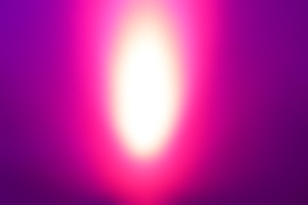 Mysterious light purple pink yellow blurred background. Spotlight mystery lights concept backdropの写真素材