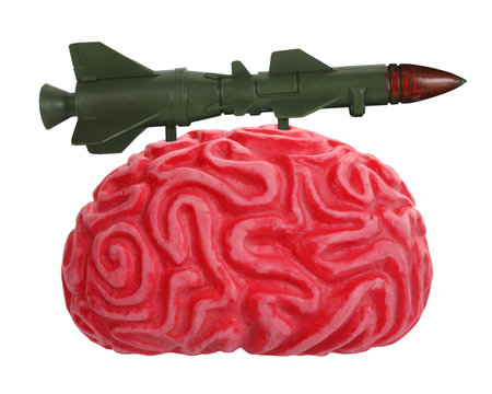 Abstract human brain armed with projectile missile bomb rocket isolated on white background. Dangerous mind concept ideaの写真素材