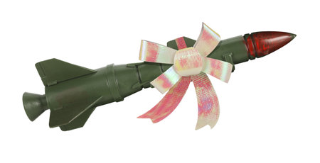 War missile rocket weapon with gift bow tie on it. Isolated on white background. Army combat drone bombing concept ideaの写真素材