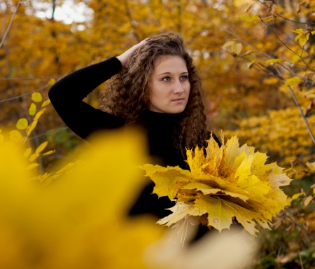 girl with yellow leavesの写真素材