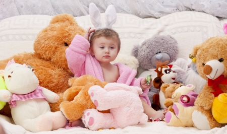 Little girl with a bunch of toysの写真素材
