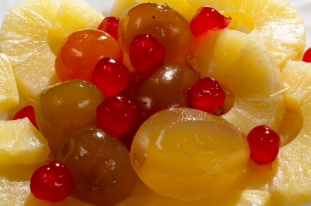 slices of pineapple and peach in the backgroundの写真素材