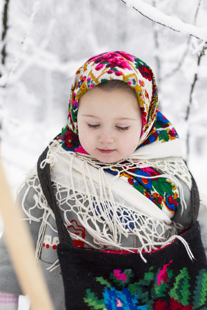 little girl with bagels winterの写真素材