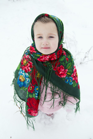 little girl with bagels winterの写真素材