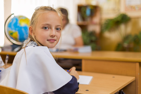 pupil at a school desk in classroomの写真素材
