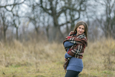 beautiful girl in the late autumn natureの写真素材