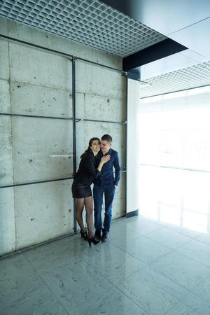 Young couple near the wallの写真素材