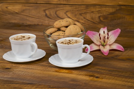 Two cups of coffee on the wooden tableの写真素材
