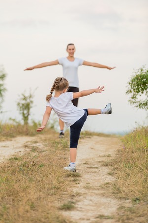 child with her mother on the nature trainの写真素材