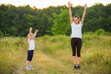 child with her mother on the nature trainの写真素材