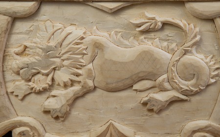 dragon carved out of wood close upの写真素材