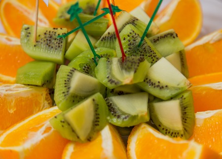 pieces of kiwi and orange close-upの写真素材