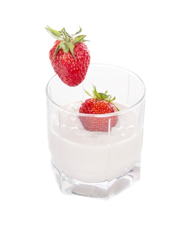 strawberry yogurt in a glass on a white backgroundの写真素材