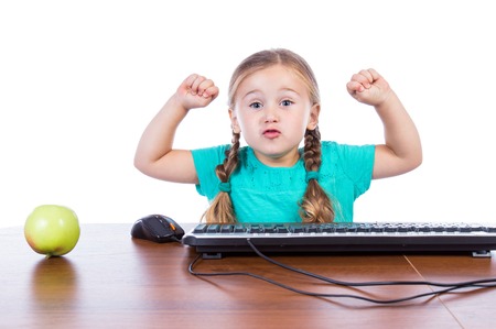 Girl at the computer on a white background