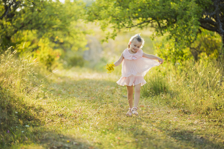 Little girl walking in a pairの写真素材