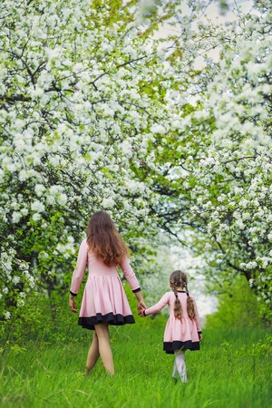 mother with her baby in spring gardenの写真素材