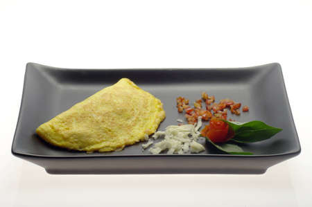 Omelet with cheese and tomatoの写真素材