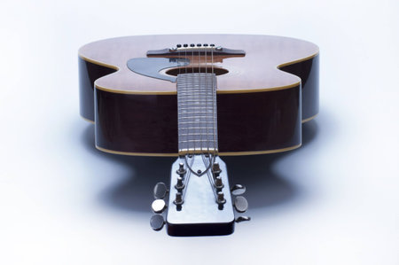 Acoustic guitar over white backgroundの写真素材
