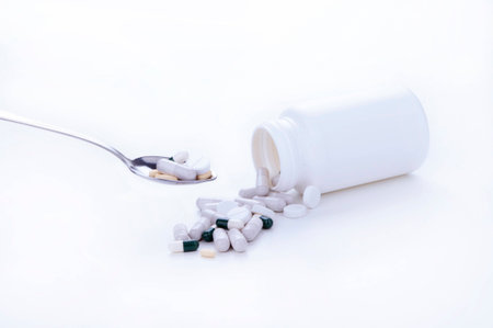 Pills and tablets on spoon の写真素材