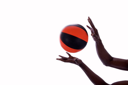 basketball with hands of man on a white backgroundの写真素材