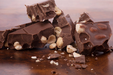chocolate chips with hazelnuts on the briar tableの写真素材