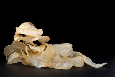 Crispy French Fries on Black Background