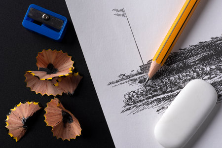 Pencil sharpener and eraser on black and white background.
