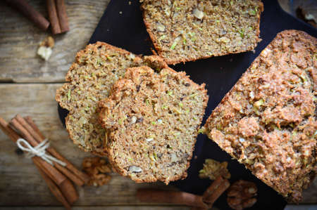 Diet baked goods made from whole grain flour and nuts. Wood background