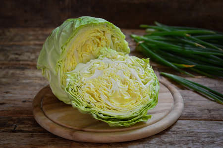 Fresh cabbage on wooden background. Healthy food concept. Selective focus.の写真素材