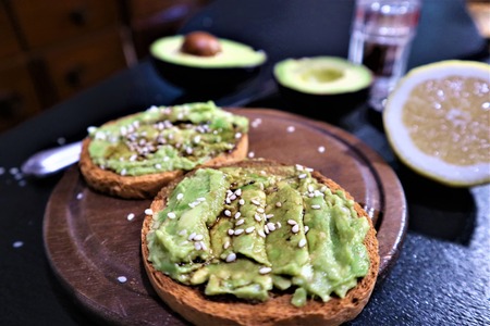 Avocado toast , overhead viewy avocado sandwich on toast bread made with fresh avocado paste on the...