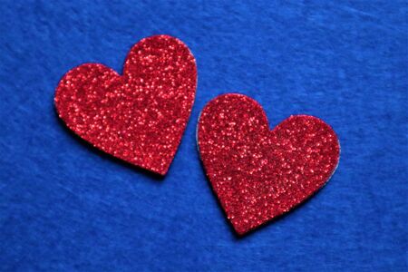 two red hearts  on classic blue background in trendy color of year 2020. Copy space.の写真素材