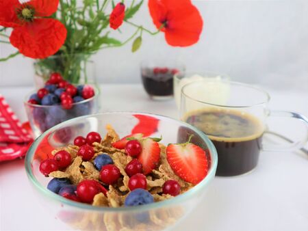 Breakfast served with coffee, cereals and fruits. Balanced diet.