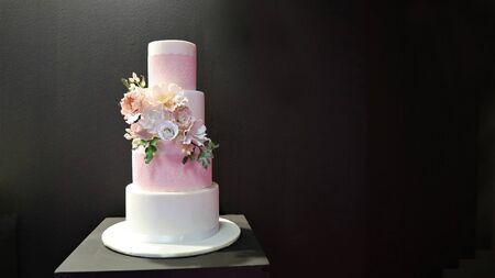White wedding cake with flowers