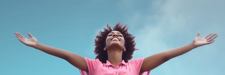 Happy young African American woman with raising her arms. Banner.の素材