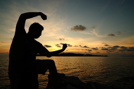 Man silhouette and yellow sky in the Eveningの写真素材