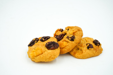 Raisin and cornflake cookies on white backgroundの写真素材