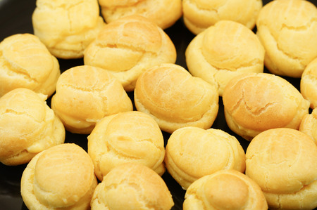 Close up Fresh Mini Cream Puffs on dishの写真素材