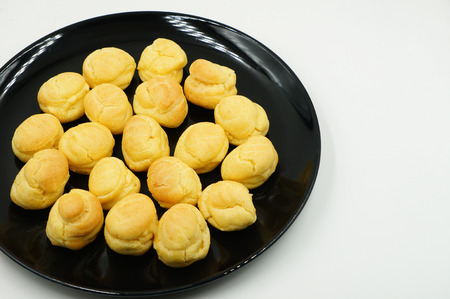 Close up Fresh Mini Cream Puffs on dishの写真素材