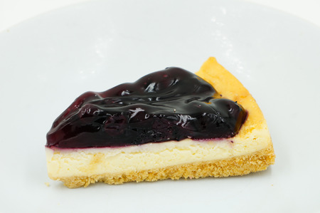 Close up Blueberry Cheesecake on white backgroundの写真素材