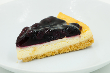 Close up Blueberry Cheesecake on white backgroundの写真素材