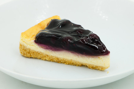 Close up Blueberry Cheesecake on white backgroundの写真素材